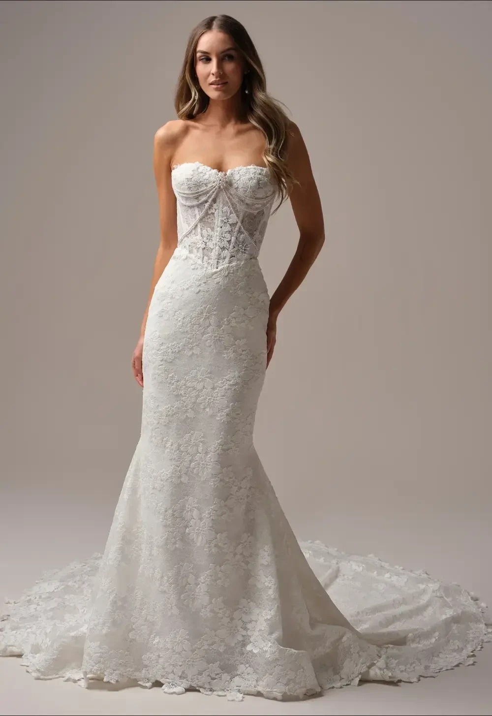 Model wearing a white gown by Maggie Sottero